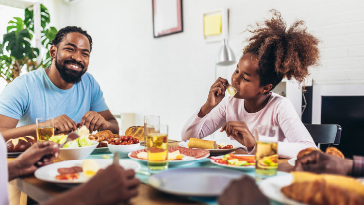 An image of a happy family enjoying a meal together.